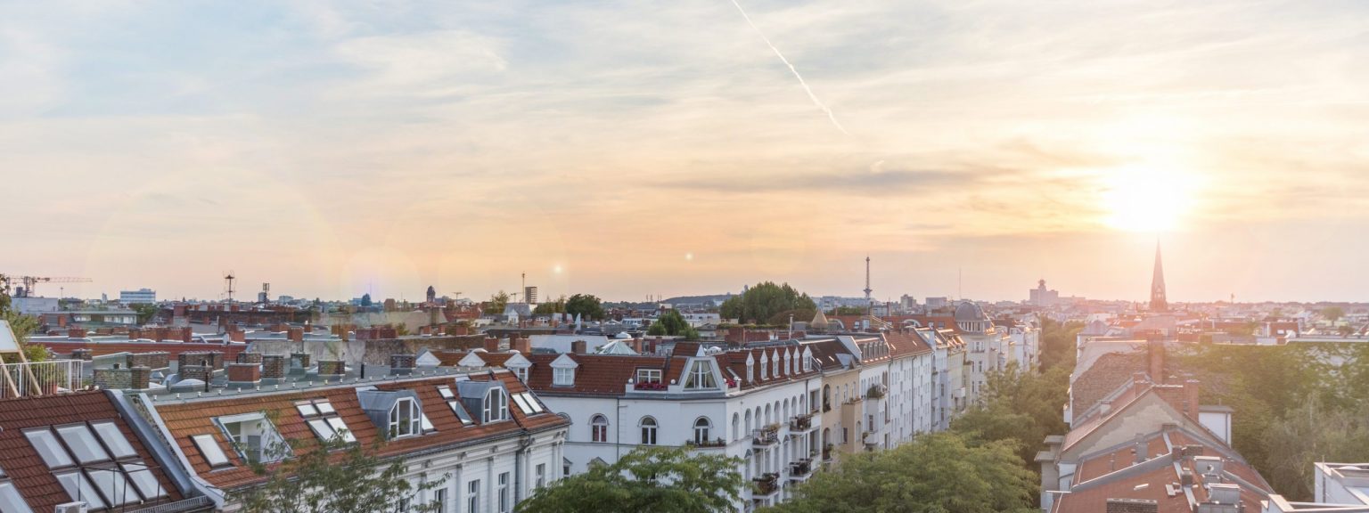 View over rooftops - city skyline at sunset